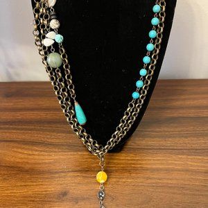 Necklace with tassel strands and bee charm